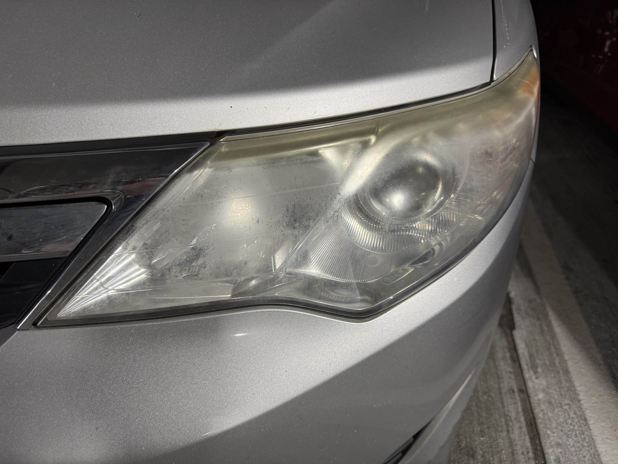 Headlight before restoration - cloudy and yellowed